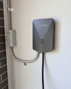Electrician installing an EV charger at a home in Epping NSW